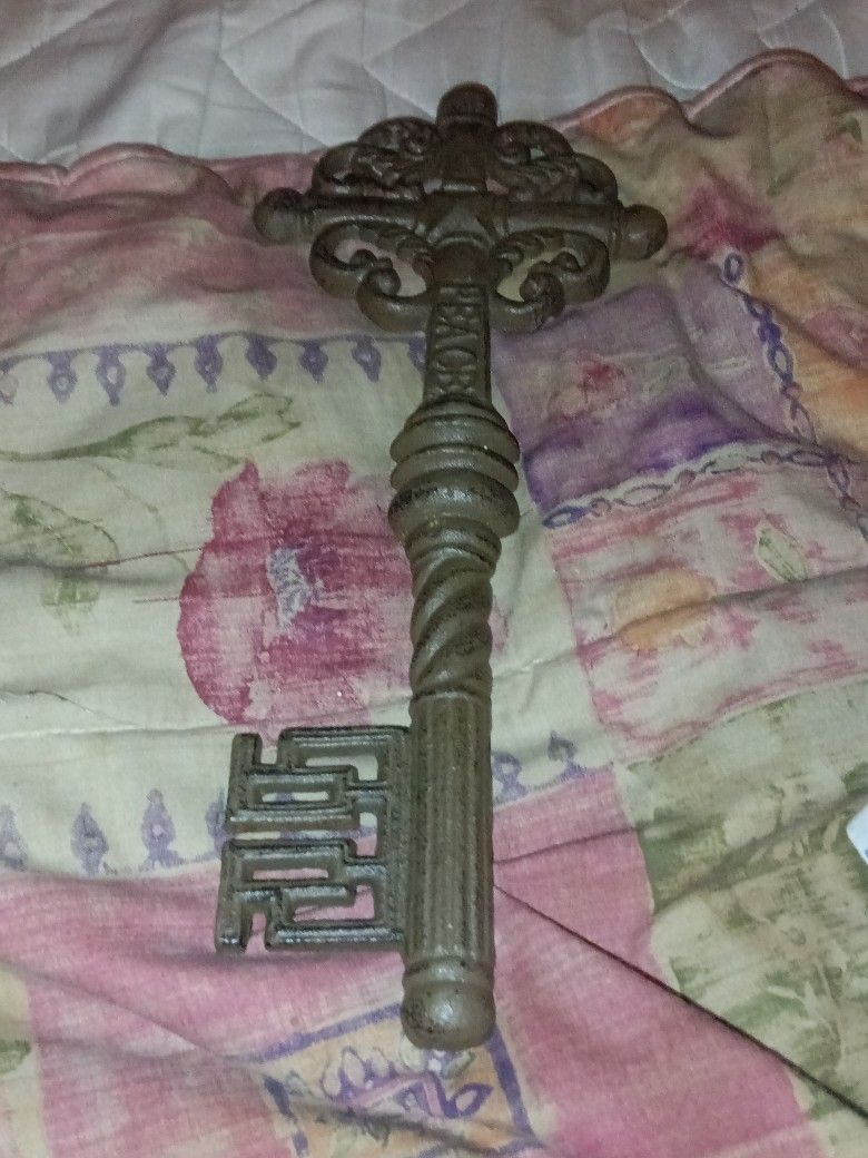 Two Keys And A Aluminum Tripod Metal Rack
