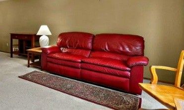 Red Leather sofa, recliner, good condition 76×36×36