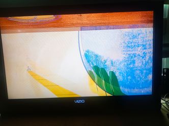 Vizio TV with built in sound bar,  L 30.5", H 20" W 3"