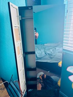 Mirror with jewelry storage