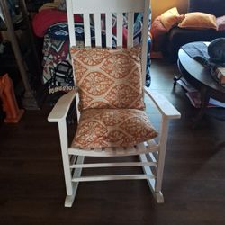 White Rocking Chair With Orange Cushions