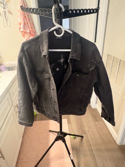 Women’s washed look black chain jacket with astrology type design