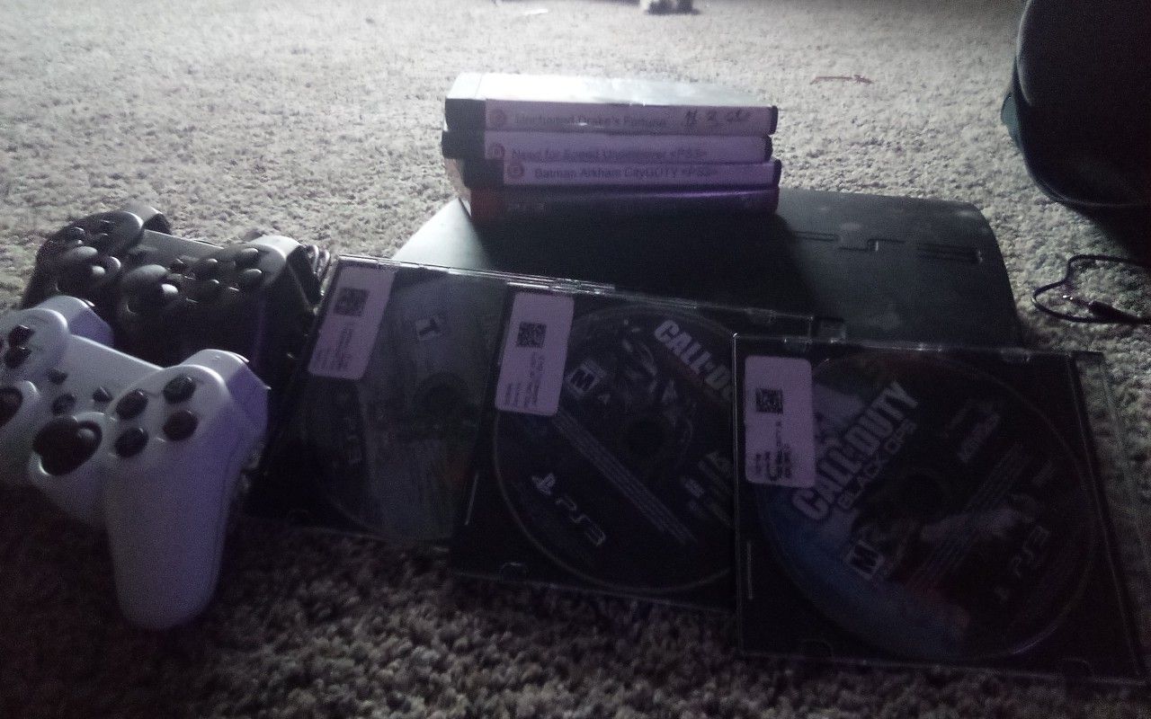 Ps3 with 2 controllers & games