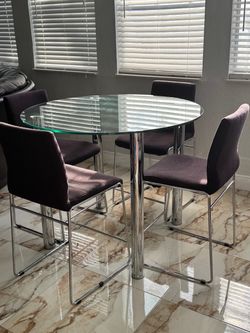 Round pedestal bar top table and four chairs USED 60.00 OBO