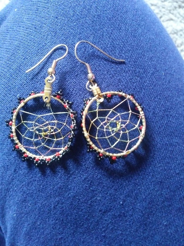 A pair of dream catcher earrings