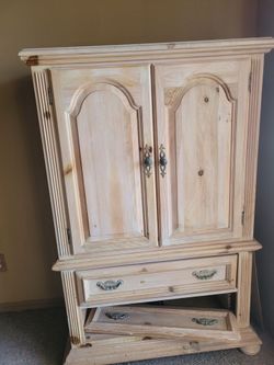 Beautiful solid wood armoire/cabinet with a rustic finish.