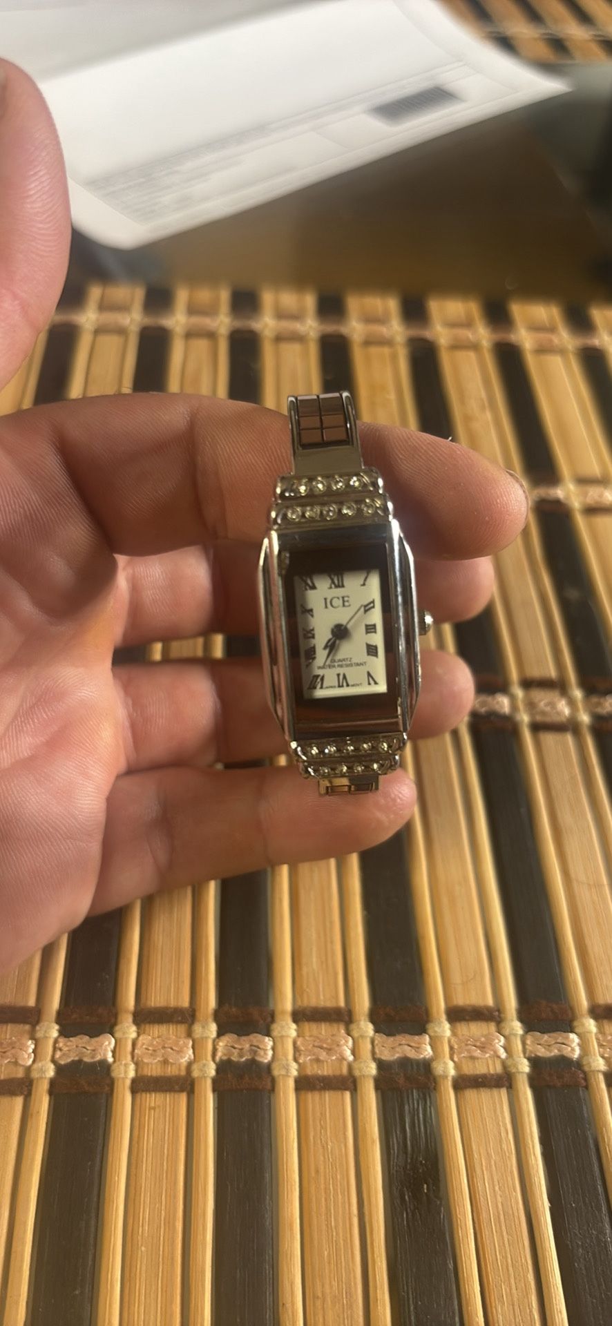 ICE brand women's wristwatch with a silver metal strap and rhinestone embellishments. Working good