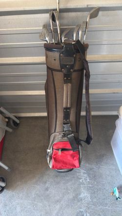 Vintage golf bag with clubs