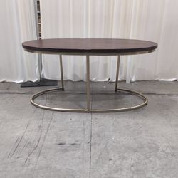 Oval Dark Brown Wood and Gold Metal Coffee Table
