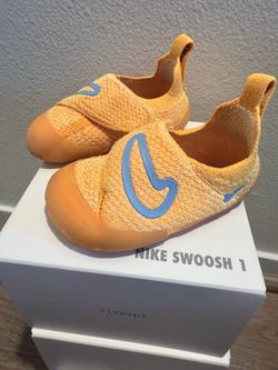 Baby Nike swoosh