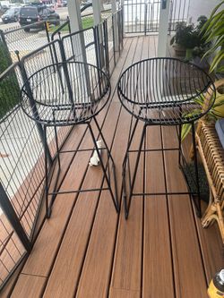 Set of two counter height black metal bar stools