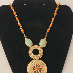 Lia Sophia 36" Fashion Gold Tone Mint Green & Orange Pendant Style Necklace. Elevate your style with this stunning Lia Sophia necklace. The gold-tone 