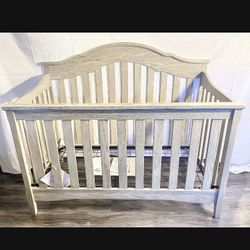 Adjustable Light Gray Wood Grain Unisex Crib