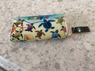Curaçao wallet and beach towel holder