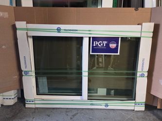 Brand New 58W x 47.5H PGT Impact Vinyl Sliding Window