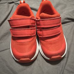 Athletic red tennis shoes for toddlers