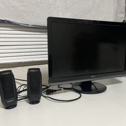 dell monitor and two logitech speakers 
