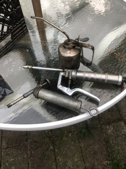 Vintage grease guns oil can