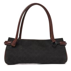 Authentic Gucci mini shoulder bag featuring the iconic GG canvas with brown leather trim. A timeless and elegant vintage design — compact yet stylish,