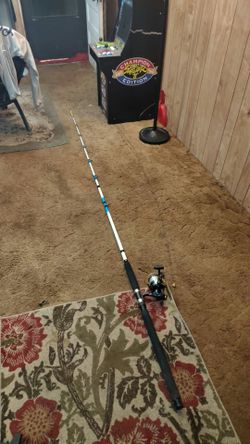 Super stick glow in the dark 10 foot catfish pole with a offshore angler catfish reel on it