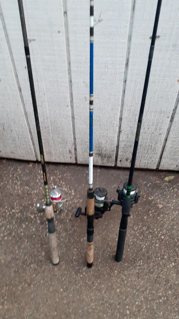 Three fishing poles with reels