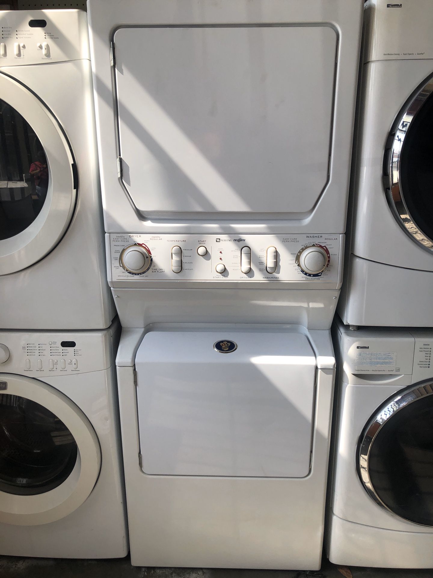 STACKED FRONT LOAD WASHER/GAS DRYER.