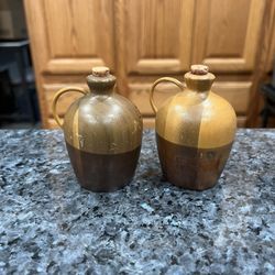 Vintage Wood Moonshine Jug Pair of Salt and Pepper Shakers. Size approximately 3 1/4 inches tall. Preowned.