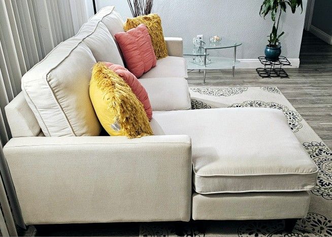 Like new!! Excellent condition 2-piece sectional sofa, the chaise can be placed on either side, removable covers for washing, delivery available for a