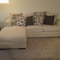 White/Beige Sofa With Pillows