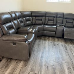 New Reclining Sectional .  Grey Gel Leatherette .  106” X 106”.  Free Delivery !