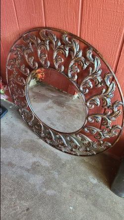 large antique metal mirror