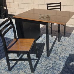 Wooden drop-leaf dining set. 