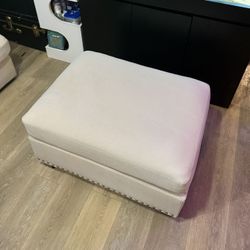 Upholstered Ottoman With Nailhead Trim 