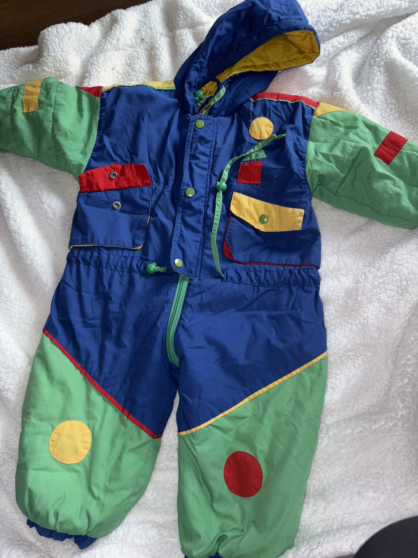  vintage snow suit kids from Kalamazoo Kids is a stylish and unique option for young children to stay warm and cozy during snowy days. Made with a dur
