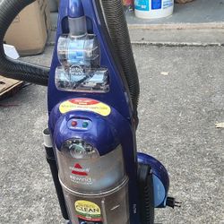 The item in the image is a Bissell Rewind SmartClean Upright Vacuum, likely model 58F8-3. 
Cleaning Width: 15-inch cleaning path.
Motor: 12 amp motor.
