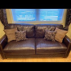 2 brown leather sofa couches