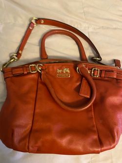 red coach hand bag