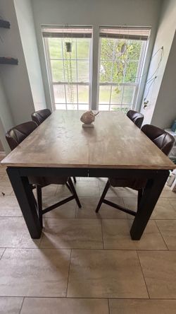 Large, solid wood, high top dining table set