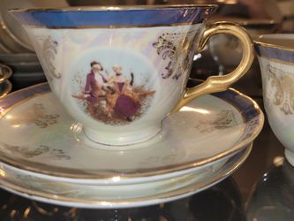 vintage porcelain demitasse cup and saucer set"Victorian Couple"