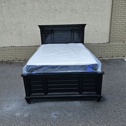 Black full-size Hilton solid wood bed Frame with Brand new full-size plush mattress and box spring in plastics
