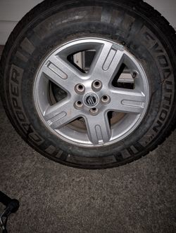 One mercury Mariner Rim And Tire