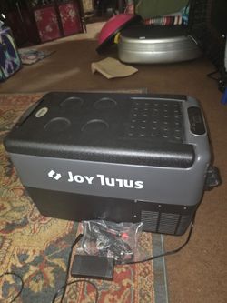 Selling a new JOYTUTUS fridge freezer its 26 quart
