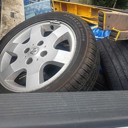 3 Nissan Aluminum Rims 4 Lug With Tires One Rim Is Black There Is 4 Total Tires Look New. 100