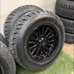 NEW 20 inch gloss black wheels wrapped in 35x12.50R20 tires