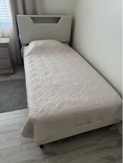 Twin size bed frame with orthopedic mattress