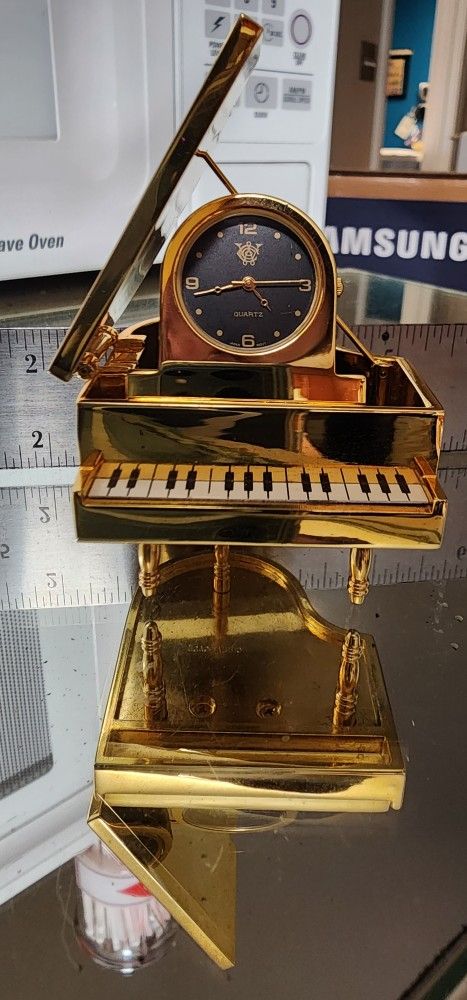 Timex quartz watch on gold (not real gold) piano