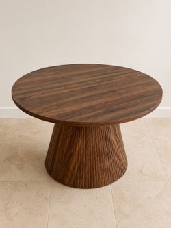 Brown round fluted extendable dining table