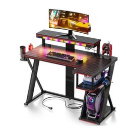 42-inch L-shaped Gaming Desk with RGB Music Sync Lights, 3 AC Outlets & Dual Cup Holders - Black