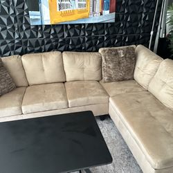 Tan Sectional And Black Coffee Table Set 