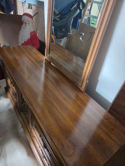 4 piece bedroom set, queen or full, heavy furniture. And in good used condition.